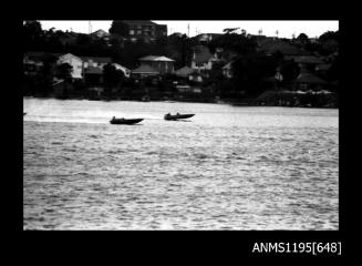 Hen and Chicken Bay 1970s, two unidentified outboard powerboats