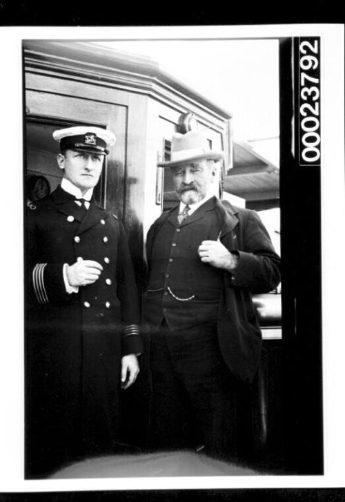 Naval officer and man in civilian clothes