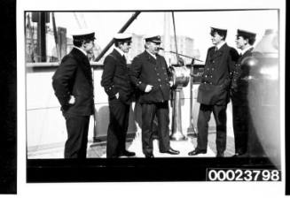 Row of five officers on deck neat telegraph