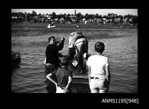 Cabarita 1970, driver Ern Nunn boarding inboard hydroplane WASP TOO