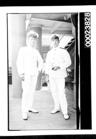 Two officers in uniform on deck