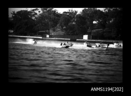 Hen and Chicken Bay 1970s, seven unidentified powerboats