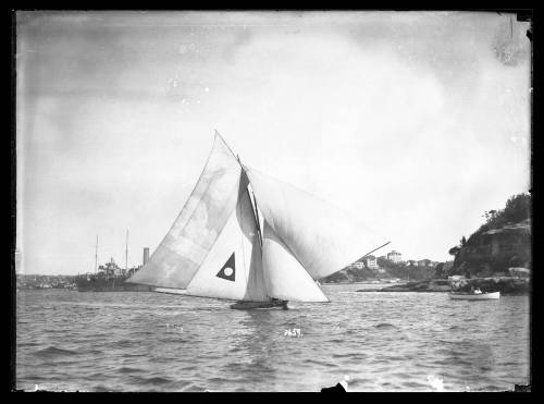 18-foot skiff sails on Sydney Harbour with full rigg, large extra headsail and a 'ringtail' sail added to mainsail