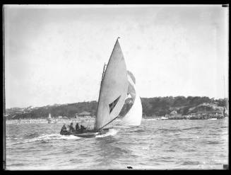 18-foot skiff sails past Nielsen Park with one woman crew member