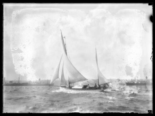 Ketch and freighters on Sydney Harbour