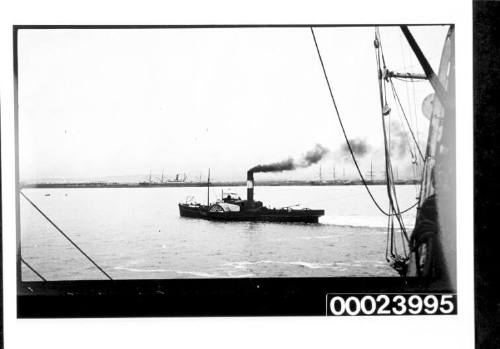 Harbour scene with paddle wheel tug