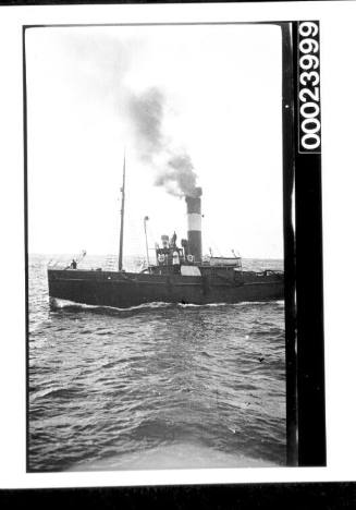 Portside view of the single funnel tug CHAMPION
