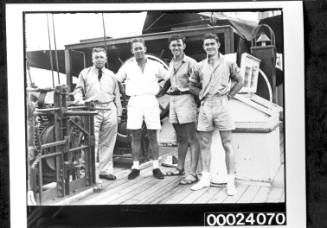 Captain Horace Stanley Collier and three men on board the four-masted barque PAMIR