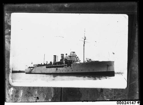 Warship at anchor in harbour