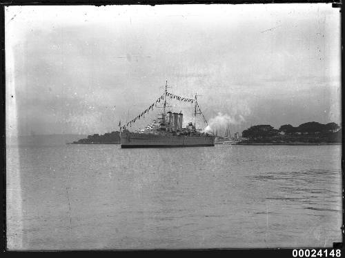 Naval warship dressed overall in Farm Cove, Sydney