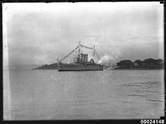 Naval warship dressed overall in Farm Cove, Sydney