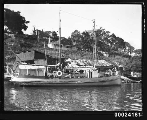 Starboard view of a sailing vessel berthed at a wharf