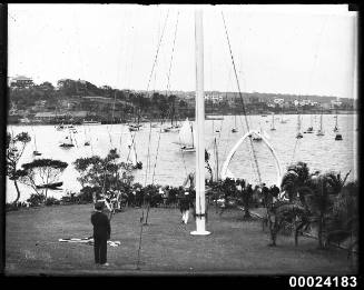 The Royal Sydney Yacht Squadron foreshore parkland area with flagpole and whale jawbones visible in background