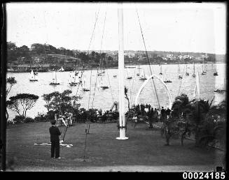 The Royal Sydney Yacht Squadron foreshore parkland area with flagpole and whale jawbones visible in background