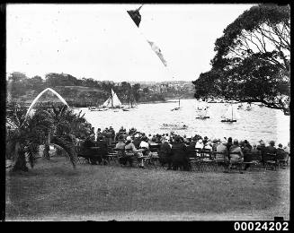 Group of people seated on chairs at the Royal Sydney Yacht Squadron