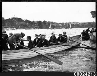 Opening yacht season, merchant sailors and two men wearing suits in a row boat