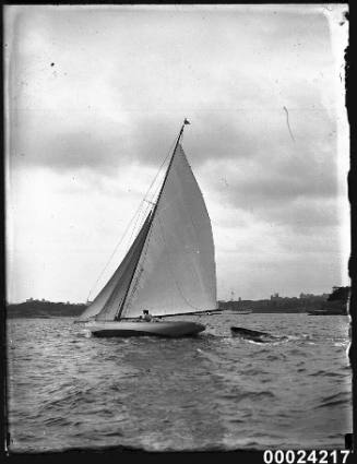 Cutter towing a dinghy in the harbour