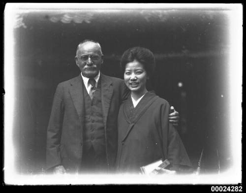 Portrait of a man with a woman in a kimono style dress possibly in Nagoya, Japan