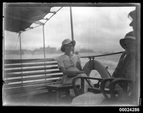 Two young girls seated on a bench possibly on board SS TANDA