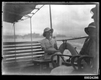 Two young girls seated on a bench possibly on board SS TANDA