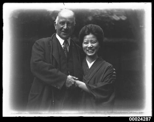 Portrait of a man with a woman in a kimono style dress possibly in Nagoya, Japan