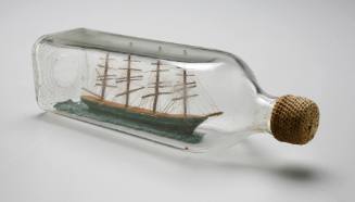Four masted ship model in a bottle