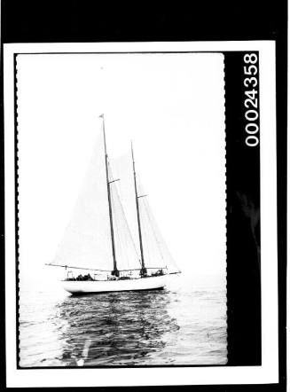 Broadside view of yacht under sail