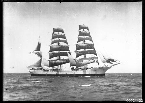 Starboard view of a three-masted barque underway at sea