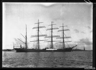 Starboard view of a four-masted barque anchored in a harbour