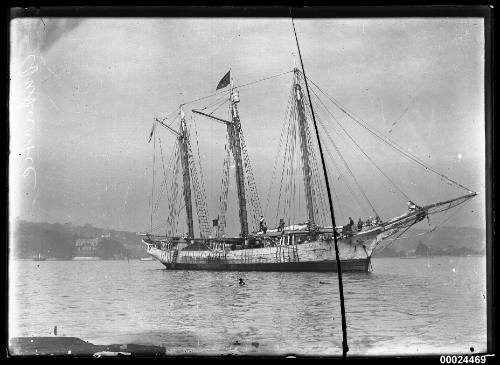 Starboard side of three-masted schooner ANTARCTIC anchored in a harbour