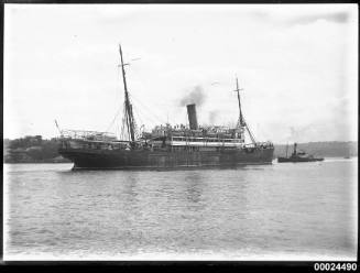 Stern and starboard view of a single funnel merchant ship possibly SS LUCIE WOERMANN in Sydney
