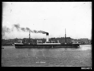 SS TYDEUS under steam in a harbour