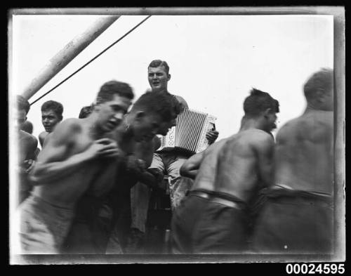 Sailors and an accordion player on board MAGDALENE VINNEN