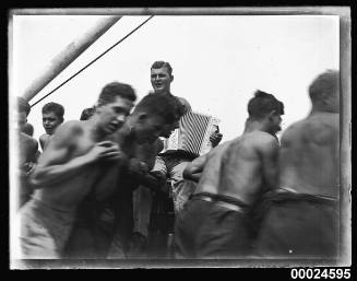 Sailors and an accordion player on board MAGDALENE VINNEN