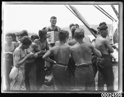 Sailors and an accordion player on board MAGDALENE VINNEN