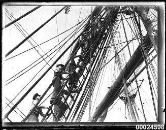 Six sailors climbing the mast of MAGDALENE VINNEN
