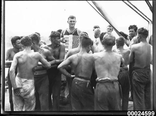 Sailors and an accordion player on board MAGDALENE VINNEN