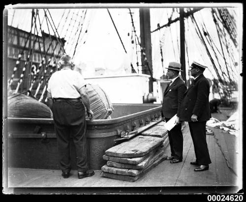 Wool being hoisted with a winch into the hold of MAGDALENE VINNEN