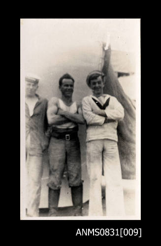 Three uniformed sailors