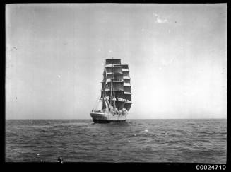 Three mast barque under full sail at sea