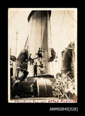 Painting the funnel of HMAS SYDNEY II