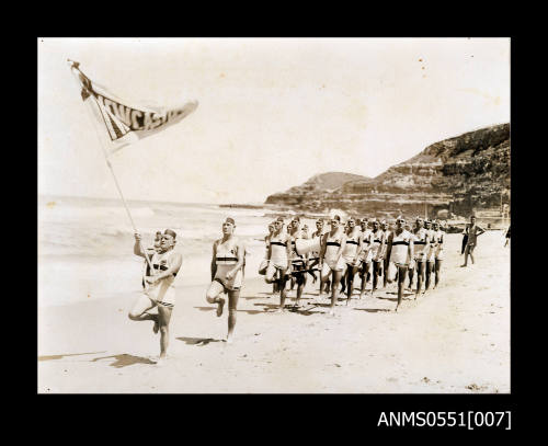 March Past ceremony Newcastle Surf Lifesaving team with Joe Palmer as standard bearer