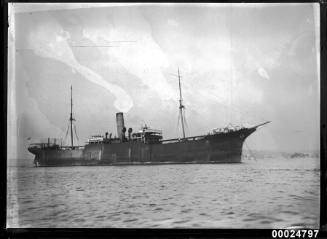 Cargo steamship with clipper bow and figurehead