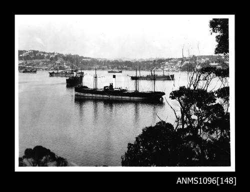 Overlooking harbour with six steamships