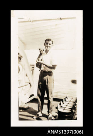 Photograph from Captain William Fowler' photo album depicting a man on a ship's deck
