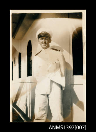 Photograph from Captain William Fowler' photo album depicting a man on a ship's deck