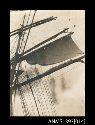 Photograph from Captain William Fowler' photo album depicting a vessel's mast and sails