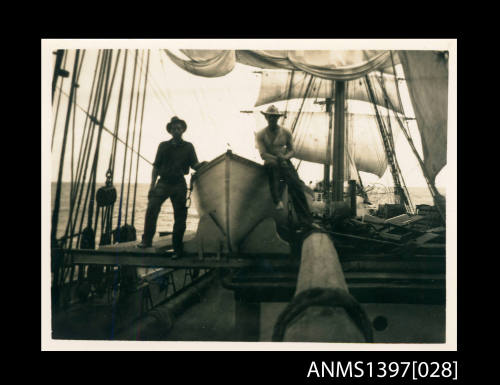 Photograph depicting two men on a ship's deck