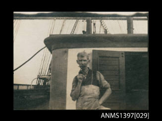 Photograph depicting a man on a ship's deck