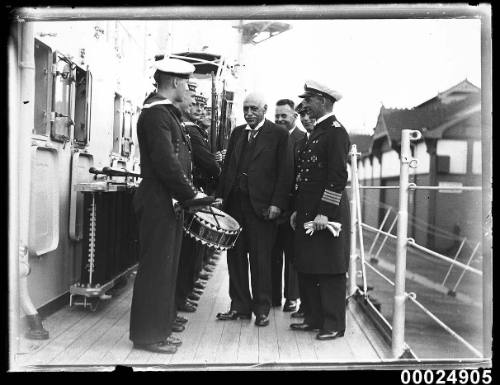 Man inspecting the crew of German cruiser KOLN at Circular Quay